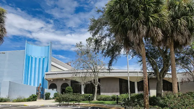 Saint Luke Church framed by palms and oaks in Barefoot Bay, Brevard County, Florida